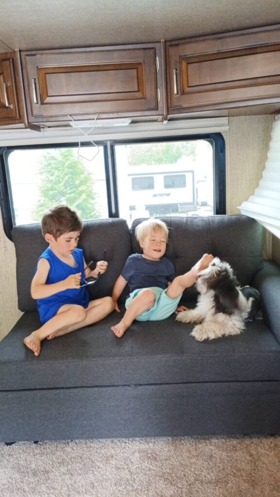 Kids being playful inside their RV during workamping with kids