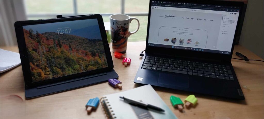 Laptop and iPad with coffee representing remote work for RV families