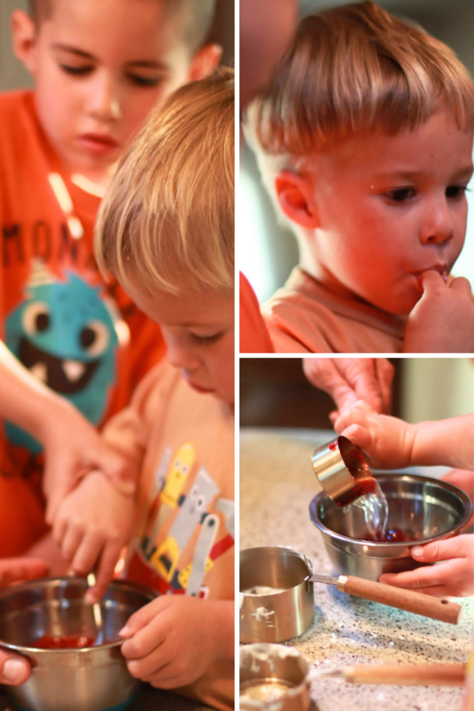 Toddlers in the kitchen making a kid friendly yogurt parfait recipe and easy no bake raspberry parfait recipe together