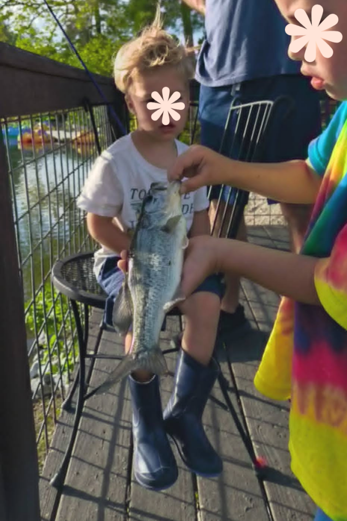 Family RV Park Near Asheville With Lake: 9 Amazing Reasons Families Love Rutledge Lake RV Park 9 Fishing in Fletcher NC at Rutledge Lake RV Park with child enjoying catch and release at the lake