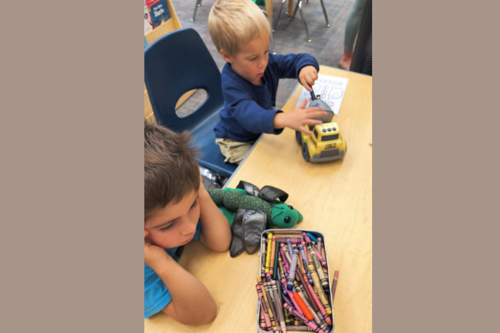 101 RV Homeschool: The Best Guide to Homeschooling While Full-Time RVing 7 Children coloring together at a library as part of RV homeschooling and road trip learning activities supporting creativity and homeschool learning