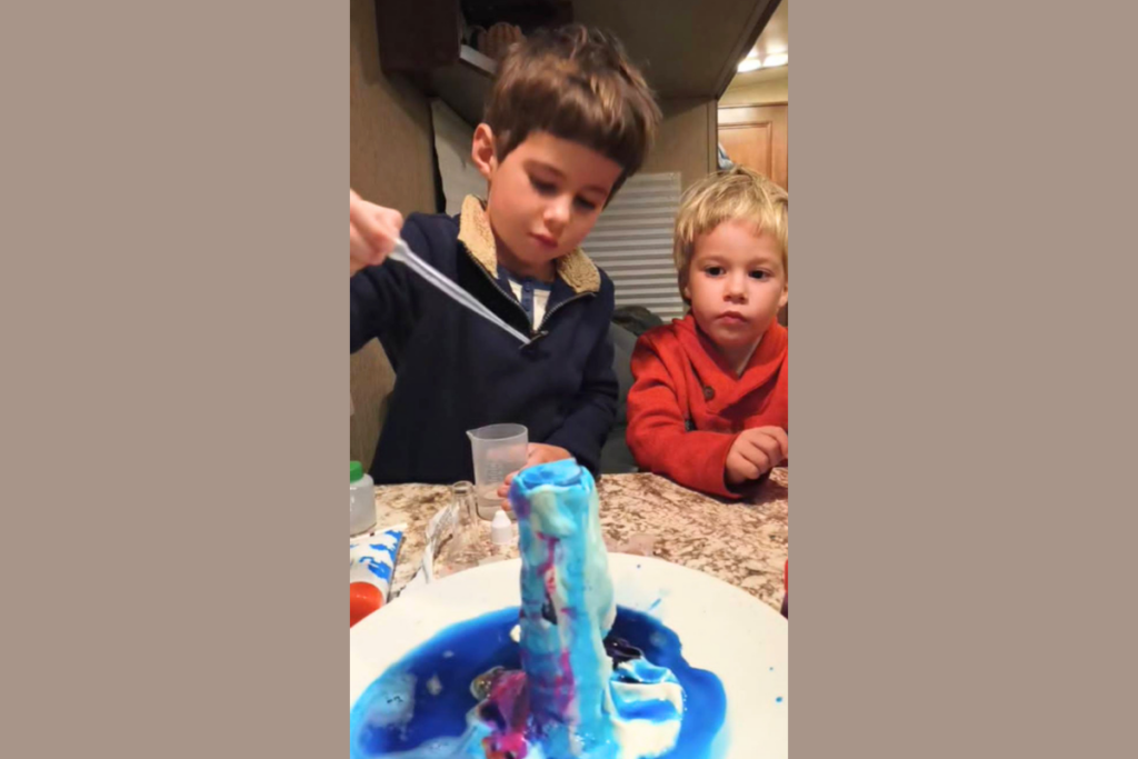 101 RV Homeschool: The Best Guide to Homeschooling While Full-Time RVing 6 Children doing a hands-on science experiment as part of RV homeschooling curriculum focused on learning, discovery, and family education