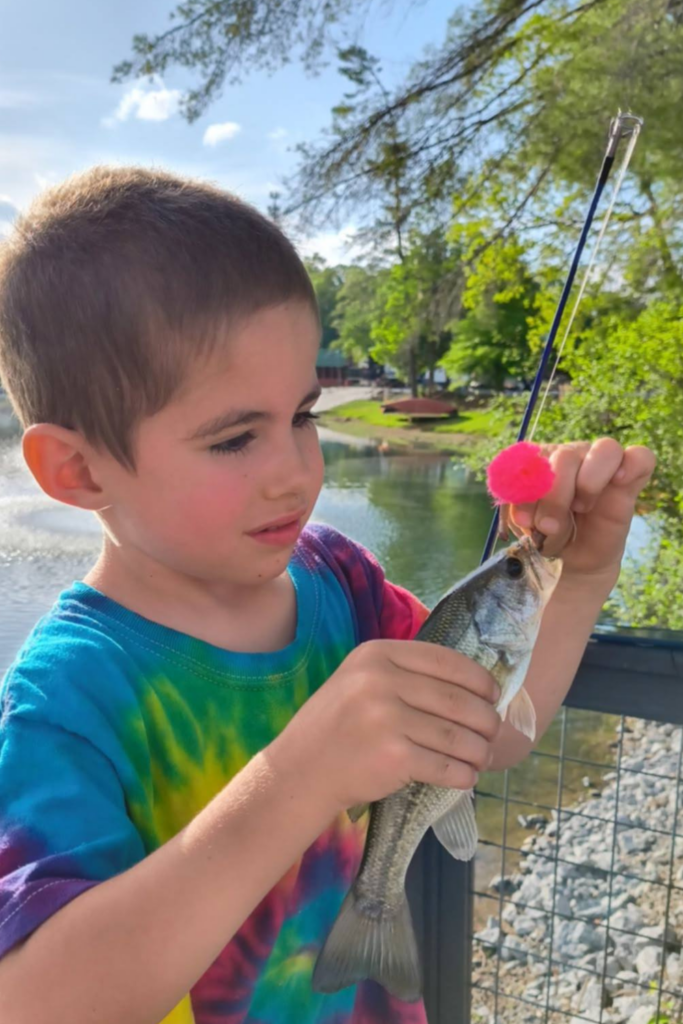 Full Time RV Living With Kids: 9 Essential Tips for a Successful Workamping Life 6 Kids fishing while living full time in an RV campground