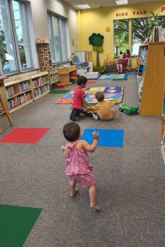 RV Activities for Kids: 50+ Amazing Ideas for Fun Family RV Living 13 Children exploring books at a local library as educational RV activities for kids during full-time RV living