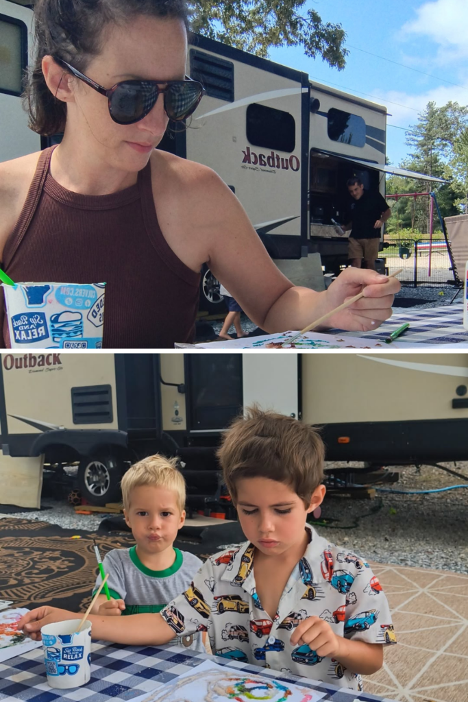 Family enjoying a salt painting activity with kids while camping in an RV