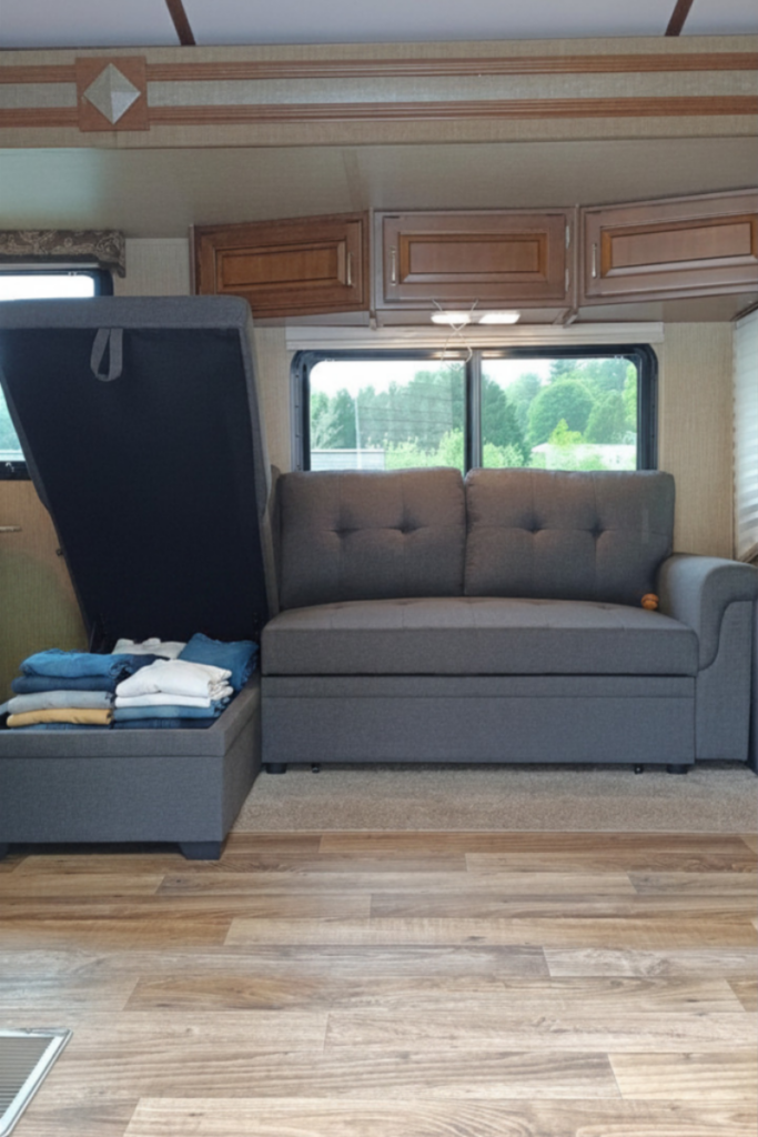 15 RV Laundry Hacks: Easy Secrets to Make Laundry Less Stressful 7 Folded clothes organized inside RV storage bench for efficient camper laundry organization
