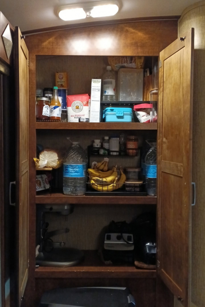 Organized RV kitchen cabinets with everyday cooking supplies
