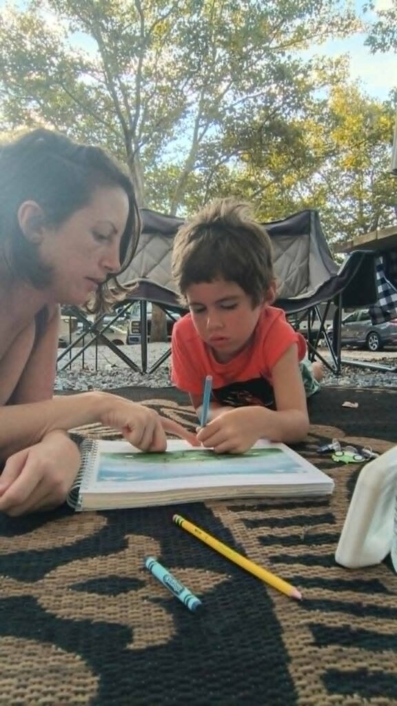 mom and son homeschooling while rving